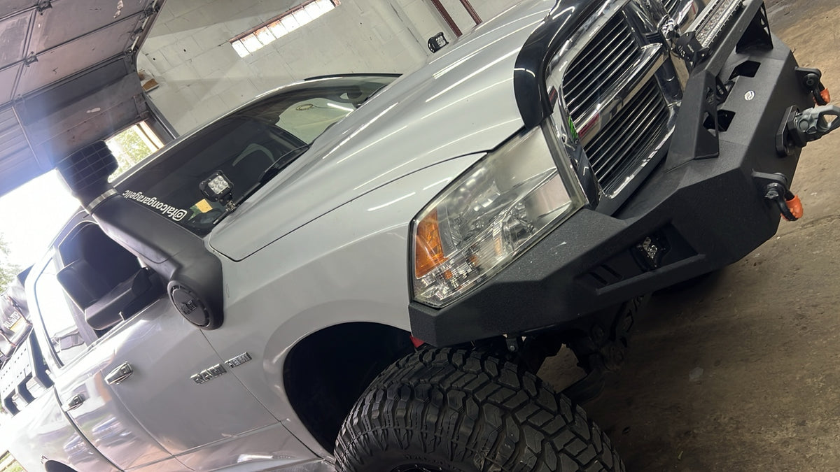 Ram 1500 with off-road bumper, lighting and suspension upgrades at Falcon Garage