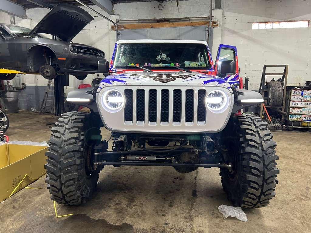 Custom lifted Jeep Wrangler inside Falcon Garage in Columbus Ohio