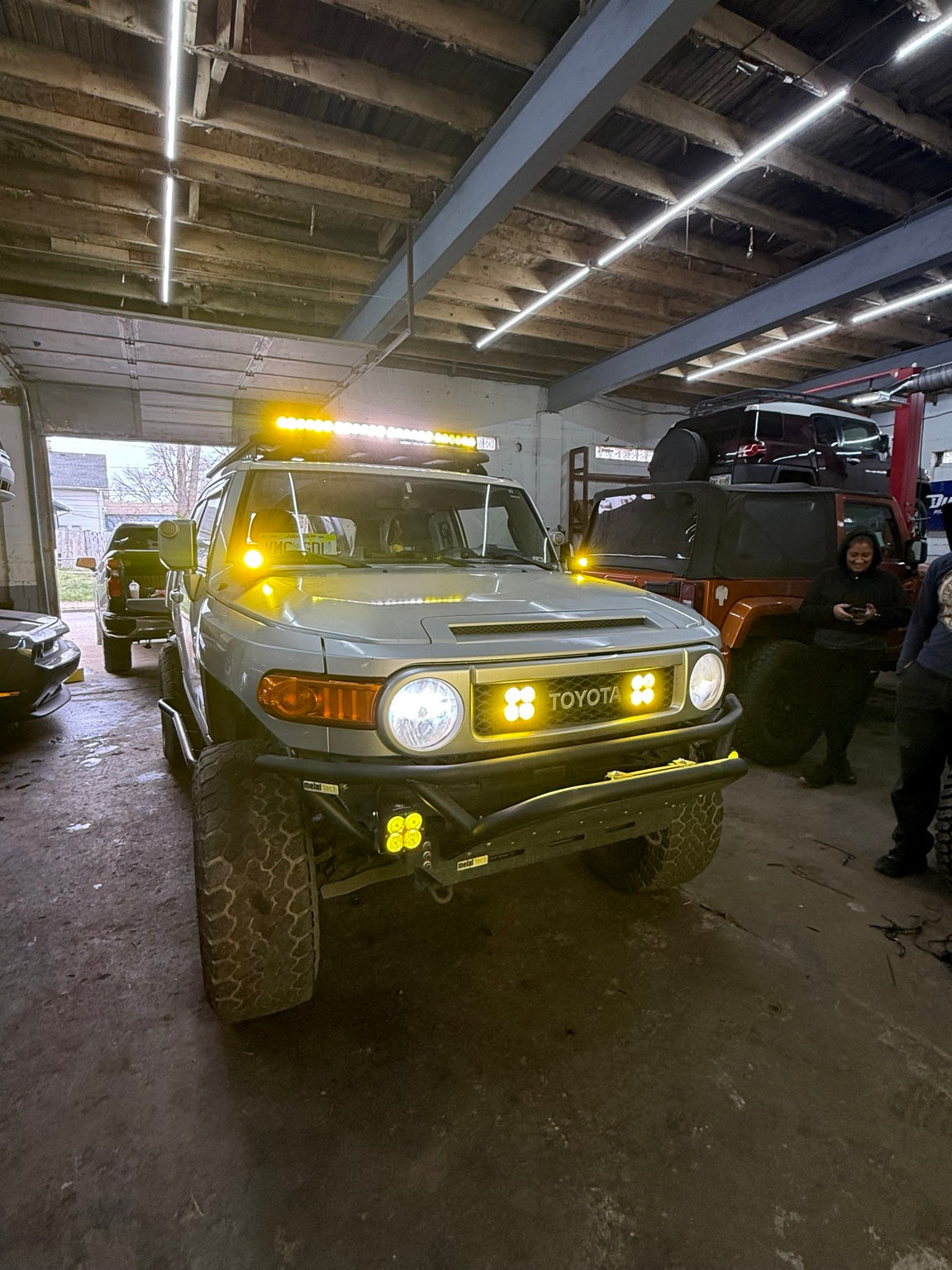 Finished Toyota FJ Cruiser off-road build with bumper, winch and amber auxiliary lighting at Falcon Garage